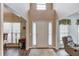 Bright entryway featuring wood-look flooring, neutral paint, and a view to the living room at 658 Eight Point Ct, Suwanee, GA 30024