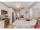 Open kitchen with a peninsula, granite countertops, stainless steel appliances, and ample cabinet space at 658 Eight Point Ct, Suwanee, GA 30024
