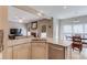Open layout kitchen with stainless appliances, granite counters and adjacent breakfast nook at 658 Eight Point Ct, Suwanee, GA 30024