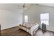 Bright main bedroom with hardwood floors, a ceiling fan, and large windows at 658 Eight Point Ct, Suwanee, GA 30024