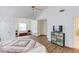 Large main bedroom with sitting area, hardwood floors, and vaulted ceilings at 658 Eight Point Ct, Suwanee, GA 30024