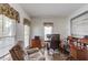 Functional home office with ample natural light and a comfortable seating area at 658 Eight Point Ct, Suwanee, GA 30024