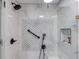 Shower featuring tile surround, glass enclosure, and shower head with hand wand at 658 Eight Point Ct, Suwanee, GA 30024