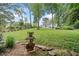Lush green backyard with a decorative swan planter provides a serene outdoor setting at 2830 Alston Drive Se Dr, Atlanta, GA 30317