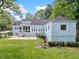 Backyard featuring a patio, lush lawn, and mature landscaping at 2830 Alston Drive Se Dr, Atlanta, GA 30317