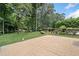 Backyard featuring a spacious patio, manicured lawn, and mature landscaping at 2830 Alston Drive Se Dr, Atlanta, GA 30317