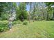 Expansive backyard with mature trees, perfect for outdoor activities and entertaining at 2830 Alston Drive Se Dr, Atlanta, GA 30317