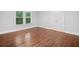 Bedroom features gleaming hardwood floors and natural light from double hung windows at 2830 Alston Drive Se Dr, Atlanta, GA 30317