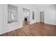 Open hallway with hardwood floors and views into the living room with fireplace at 2830 Alston Drive Se Dr, Atlanta, GA 30317