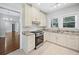 Bright kitchen with stainless steel appliances, granite countertops, and ample cabinet space at 2830 Alston Drive Se Dr, Atlanta, GA 30317