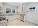 Bright kitchen with stainless steel dishwasher, granite countertops, and ample cabinet space at 2830 Alston Drive Se Dr, Atlanta, GA 30317