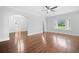 Spacious living room with hardwood flooring, a bay window, and arched entryways at 2830 Alston Drive Se Dr, Atlanta, GA 30317