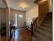 Inviting foyer with parquet floors, a decorative chandelier, and staircase leading to the upper level at 4402 Autumn Hill Drive, Stone Mountain, GA 30083