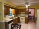 Traditional kitchen with wooden cabinets, white appliances, and durable tile flooring at 4402 Autumn Hill Drive, Stone Mountain, GA 30083