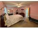 Spacious main bedroom with a queen bed, ceiling fan and private ensuite bathroom and ample closet space at 4402 Autumn Hill Drive, Stone Mountain, GA 30083