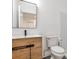 Bathroom featuring modern vanity with unique wood design and walk-in shower at 11760 Stratham Dr, Alpharetta, GA 30009
