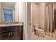Bathroom with dark cabinets, granite vanity, and shower-tub combination with curtain at 11760 Stratham Dr, Alpharetta, GA 30009