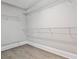 Organized closet with wire shelving and hardwood floors provides ample storage space at 11760 Stratham Dr, Alpharetta, GA 30009