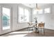 Cozy breakfast nook with a round table, modern lighting, and a door leading to a deck at 11760 Stratham Dr, Alpharetta, GA 30009