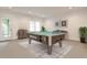 Spacious game room with pool table and plenty of natural light at 11760 Stratham Dr, Alpharetta, GA 30009