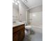 Bathroom with vanity and cabinet, toilet, and bath and shower at 41 Ridgewood Cir, Mcdonough, GA 30252