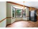 Bright dining area featuring a bay window, chandelier, and hardwood floors at 41 Ridgewood Cir, Mcdonough, GA 30252
