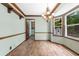 The dining room features hardwood floors, a view of the backyard, and a chandelier at 41 Ridgewood Cir, Mcdonough, GA 30252