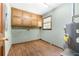 Well-lit laundry room with built-in storage cabinets and appliances at 41 Ridgewood Cir, Mcdonough, GA 30252