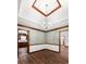 Large living room with hardwood floors, trimmed ceiling, and trimmed door and window frames at 41 Ridgewood Cir, Mcdonough, GA 30252