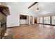 Cozy living room featuring a stone fireplace, built-in shelves, and hardwood floors, perfect for relaxing at 41 Ridgewood Cir, Mcdonough, GA 30252