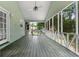 Screened in porch with wood floor, ceiling fan, wooded view at 41 Ridgewood Cir, Mcdonough, GA 30252