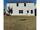 Two-story home with a backyard and lawn at 136 Paulownia Cir, Mcdonough, GA 30253