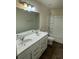 Bathroom featuring dual sinks, ample countertop space, and updated fixtures at 136 Paulownia Cir, Mcdonough, GA 30253