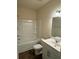 Clean bathroom featuring a combined shower and bathtub unit, vanity, and tile flooring at 136 Paulownia Cir, Mcdonough, GA 30253