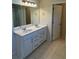 Bathroom featuring dual sinks, ample countertop space, and updated fixtures at 136 Paulownia Cir, Mcdonough, GA 30253