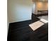 Bonus room featuring sleek, dark flooring, neutral walls, and railing at 136 Paulownia Cir, Mcdonough, GA 30253