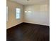 Open dining room with hardwood floors, bright windows, and modern lighting at 136 Paulownia Cir, Mcdonough, GA 30253