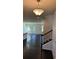 Inviting entryway with hardwood floors and staircase leading to the upper level at 136 Paulownia Cir, Mcdonough, GA 30253