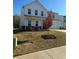 Charming two-story home with a well-manicured lawn, and a two car garage at 136 Paulownia Cir, Mcdonough, GA 30253