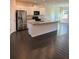 Modern kitchen with stainless steel appliances, granite counters, and white cabinetry at 136 Paulownia Cir, Mcdonough, GA 30253