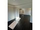 Spacious living room featuring hardwood floors and modern finishes at 136 Paulownia Cir, Mcdonough, GA 30253