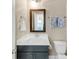 Bathroom featuring a vanity with a white countertop, dark grey cabinets and a decorative mirror at 4311 Parkside Pl, Atlanta, GA 30342