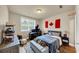 Cozy bedroom setup with neutral colors, a Canadian flag, a desk, and sports-themed decor at 4311 Parkside Pl, Atlanta, GA 30342