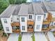 Stylish townhome featuring multiple decks and neutral exterior finishes at 4311 Parkside Pl, Atlanta, GA 30342