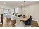 Open concept kitchen, dining and living space with hardwood floors and modern finishes at 4311 Parkside Pl, Atlanta, GA 30342