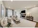 Bright living room featuring modern fireplace with brick surround, plush seating, and neutral decor at 4311 Parkside Pl, Atlanta, GA 30342