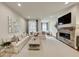 Bright living room featuring modern fireplace with brick surround, plush seating, and neutral decor at 4311 Parkside Pl, Atlanta, GA 30342