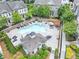 Relaxing community pool with lounge chairs, umbrellas, and nearby buildings at 4311 Parkside Pl, Atlanta, GA 30342