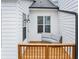 Private porch with wood floors and exterior lighting at 4311 Parkside Pl, Atlanta, GA 30342