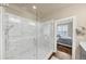 Bathroom featuring marble shower with glass door at 4311 Parkside Pl, Atlanta, GA 30342